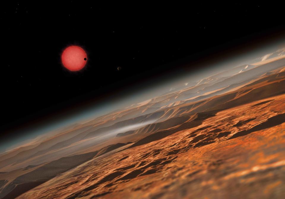 Eine Illustration der Planetenoberfläche eines Exoplaneten. Astronomen haben sieben Planeten gefunden, die so groß sind wie die Erde, aber 40 Lichtjahre entfernt von ihr.