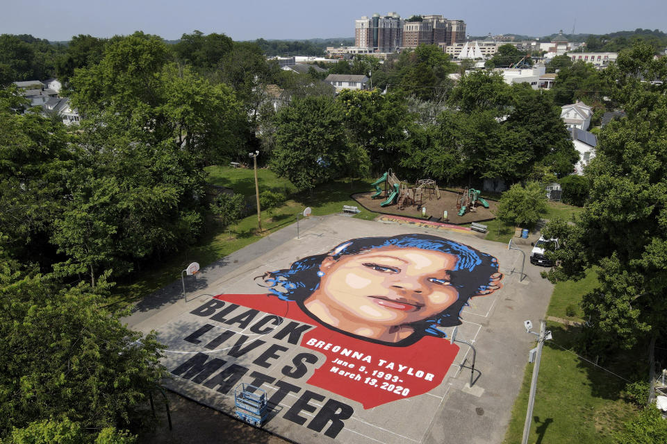 A ground mural depicting a portrait of Breonna Taylor is seen at Chambers Park, Monday, July 6, 2020, in Annapolis, Md. The mural honors Taylor, a 26-year old Black woman who was fatally shot by police in her Louisville, Kentucky, apartment. The artwork was a team effort by the Banneker-Douglass Museum, the Maryland Commission on African American History and Culture, and Future History Now, a youth organization that focuses on mural projects. (AP Photo/Julio Cortez)