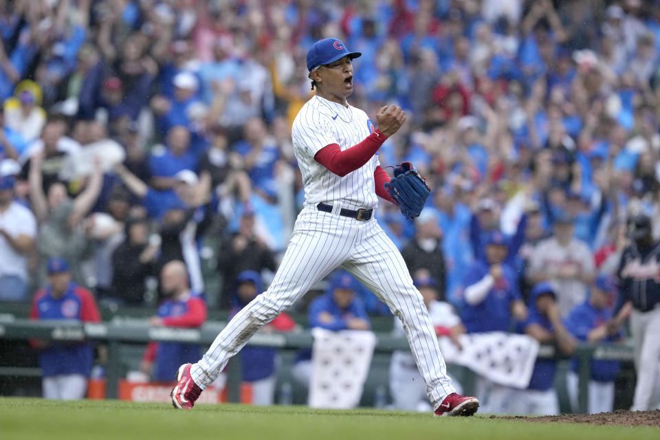 Chicago Cubs relief pitcher Adbert Alzolay reacts after the final out in the team's win over the Atlanta Braves in a baseball game Saturday, Aug. 5, 2023, in Chicago. (AP Photo/Charles Rex Arbogast)