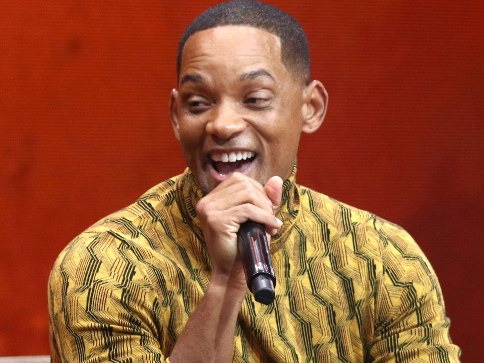 Will Smith speaking into a microphone at his book tour stop in Brooklyn in November 2021.