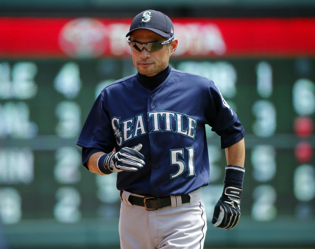 Ichiro Suzuki holds his No. 51 jersey with Seattle Mariners