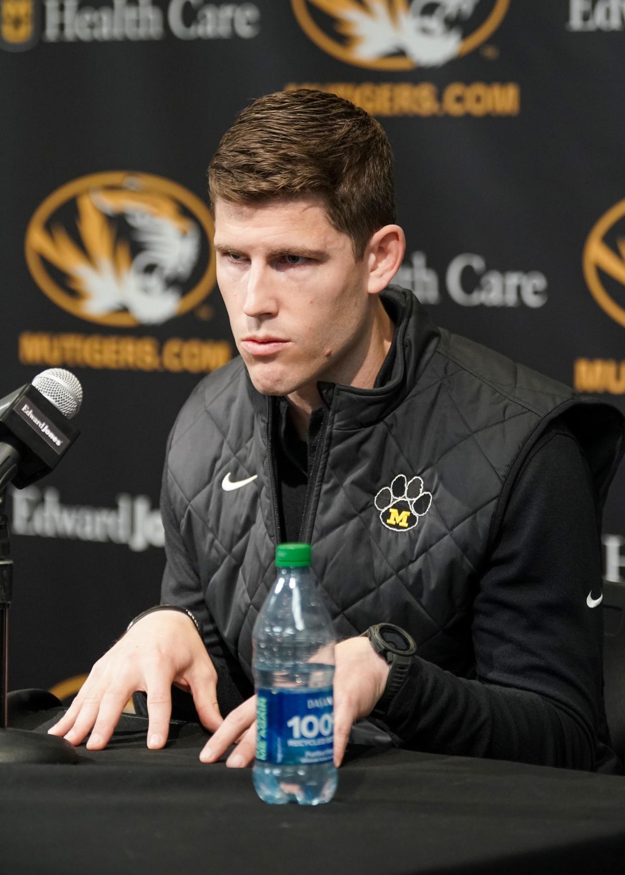 Missouri Tigers football team new offensive coordinator/quarterbacks coach Kirby Moore answers questions from reporters before the basketball game against the Vanderbilt Commodores Mizzou Arena.