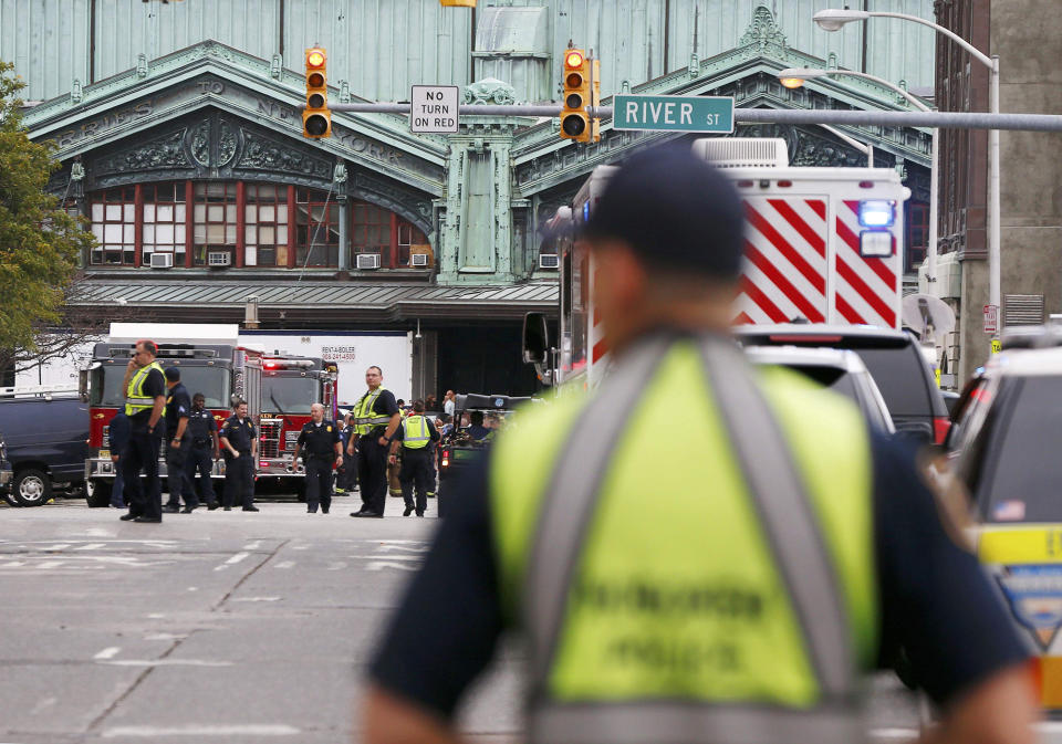 <p>Hoboken police officers look over the scene of a train crash where a New Jersey Transit train derailed and crashed through the station, injuring more than 100 people, in Hoboken, New Jersey, U.S. September 29, 2016. REUTERS/Shannon Stapleton </p>