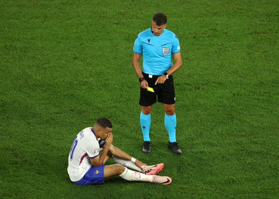 Mbappe was booked after returning to the pitch (Getty Images)