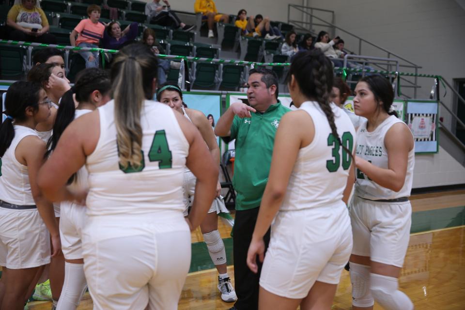 Eldorado High School head girls basketball coach Jimmy Canchola talks things over with his team during a time out in the fourth quarter of a District 7-2A girls basketball game against Ozona, Tuesday, Jan. 25, 2022, in Eldorado.