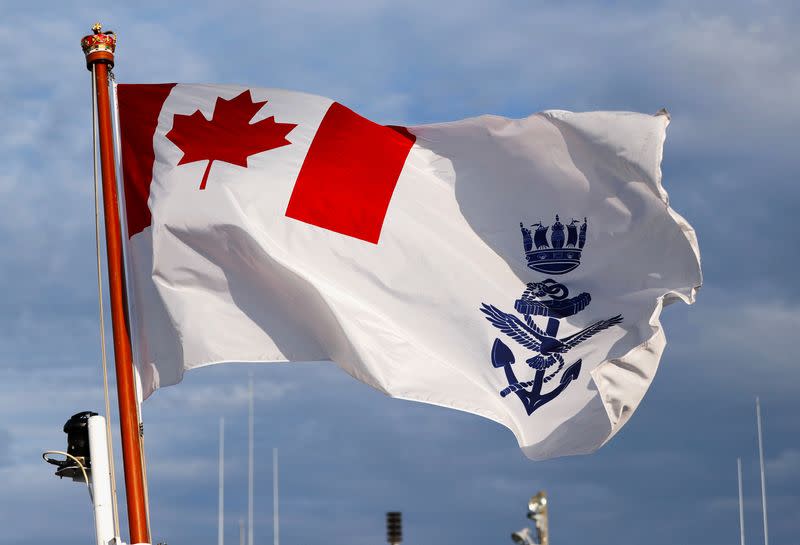 Canadian naval ensign is hoisted on the deck of the Royal Canadian Navy's HMCS Calgary at the U.S. naval base in Yokosuka