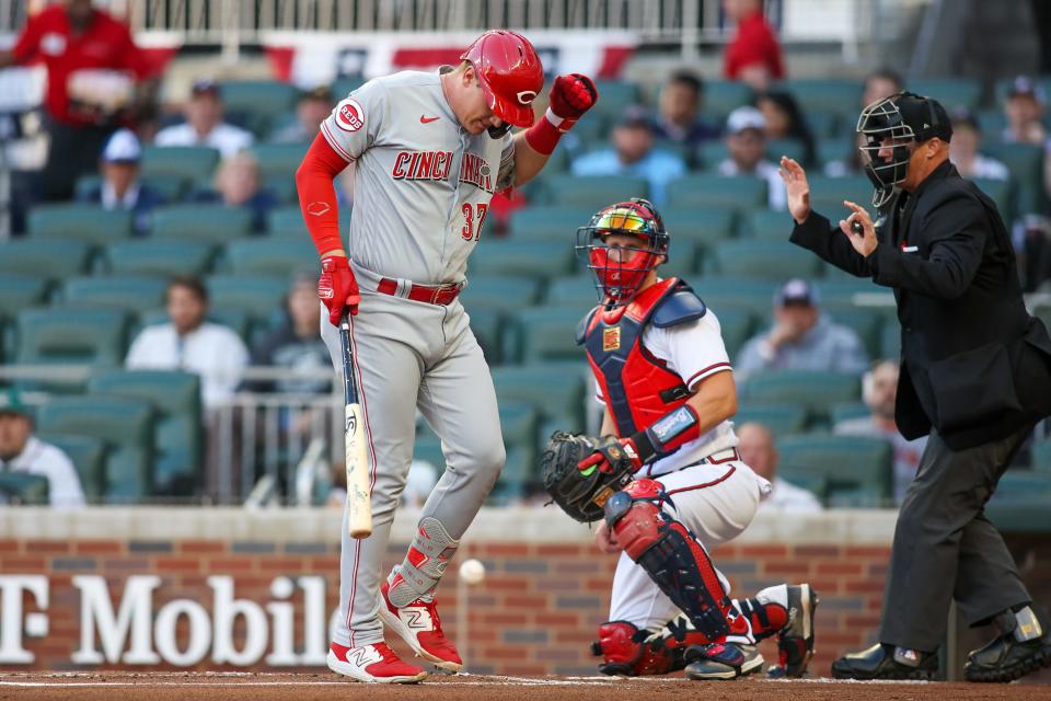 Cincinnati Reds catcher Tyler Stephenson (37) reacts after being hit by a pitch against the Atlanta Braves in the first inning at Truist Park on Tuesday.