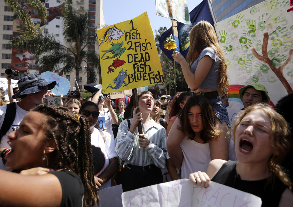 A group of young protestors chant slogans and carry signs during a global climate rally at Pershing Square in downtown Los Angeles on Friday, Sept. 20, 2019, part of a wave of protests around the world. Many young climate activists say they feel hopeless and overwhelmed _ and psychologists say that’s OK and it’s good they’re talking about it. It’s sometimes called climate change anxiety and you don’t have to be an activist or young to feel it. (AP Photo/David Swanson)