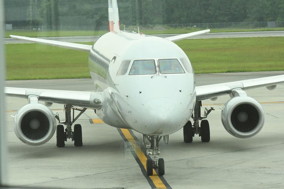 An American Airlines plane approaches approaches a gate at the Wilmington International Airport on Wednesday.