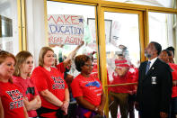 <p>Teachers and supporters hold signs during a ‘March For Students And Rally For Respect’ protest at the North Carolina State Assembly, on the first day of the state’s legislative session, in Raleigh, N.C., on Wednesday, May 16, 2018. (Photo: Charles Mostoller/Bloomberg via Getty Images) </p>