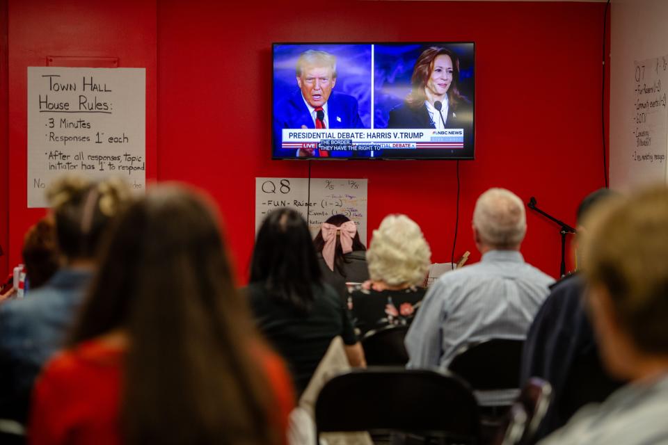 Supporters of Donald Trump watch the presidential debate at the Republican Party headquarters in Asheville, September 10, 2024.