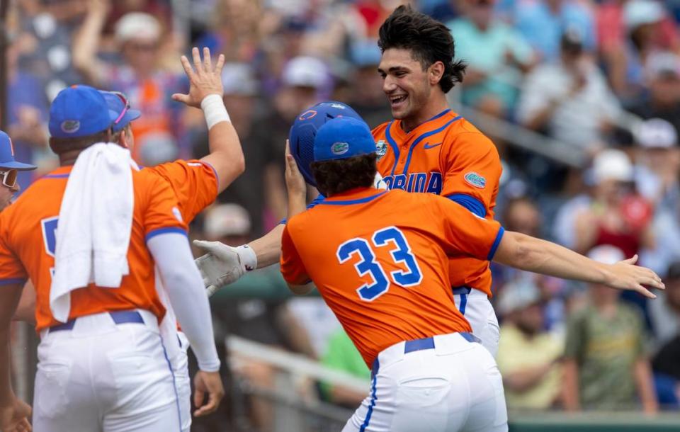 Florida pitcher Jac Caglianone (14) celebrates after connecting for a 3 RBI home run in the second inning to take a 4-1 lead against N.C. State in game seven of the College World Series on Monday, June 17, 2024 at Charles Schwab Field in Omaha, Nebraska.