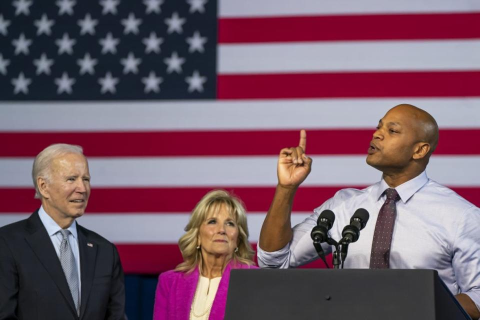 Democratic gubernatorial candidate Wes Moore (R) speaks as President Joe Biden and first lady Jill Biden look on at a campaign rally at Bowie State University on November 7, 2022 in Bowie, Maryland. Moore faces Republican state Rep. Dan Cox in tomorrow’s general election. (Photo by Nathan Howard/Getty Images)