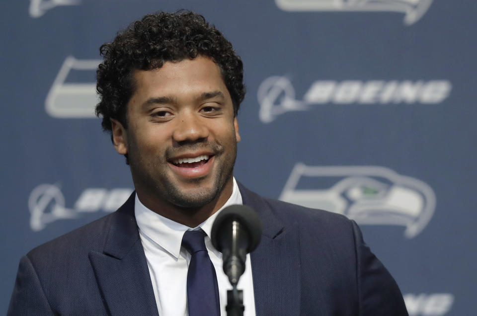 Seattle Seahawks quarterback Russell Wilson talks to reporters Wednesday, April 17, 2019, in Renton, Wash. Earlier in the week, Wilson signed a $140 million, four-year extension with the NFL football team. (AP Photo/Ted S. Warren)