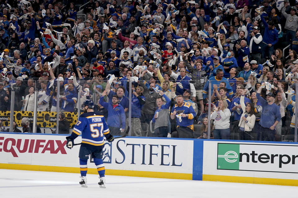 Fans cheer after a goal by St. Louis Blues' David Perron (57) during the first period in Game 4 of an NHL hockey Stanley Cup second-round playoff series between the St. Louis Blues and the Colorado Avalanche Monday, May 23, 2022, in St. Louis. (AP Photo/Jeff Roberson)