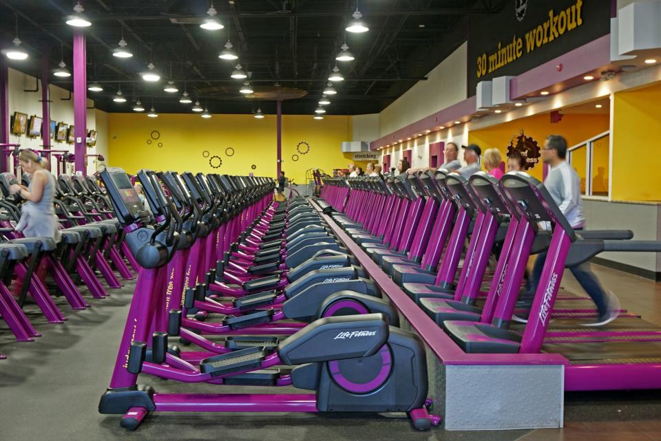Patrons work out at a Planet Fitness in Johnston in April 2019.