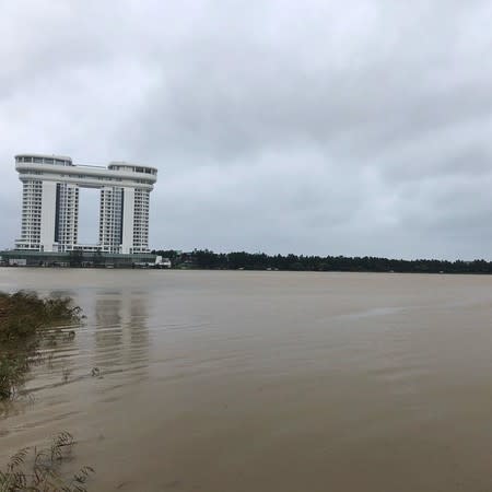 The Golden Tulip Skybay Hotel is pictured behind the Lake Gyeongpoho after Typhoon Mitag brought heavy rain and flood to Gangneung