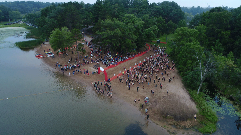 Racers prepare for the 2022 Waupaca Triathlon - which features swimming as well as kayaking for the water event.