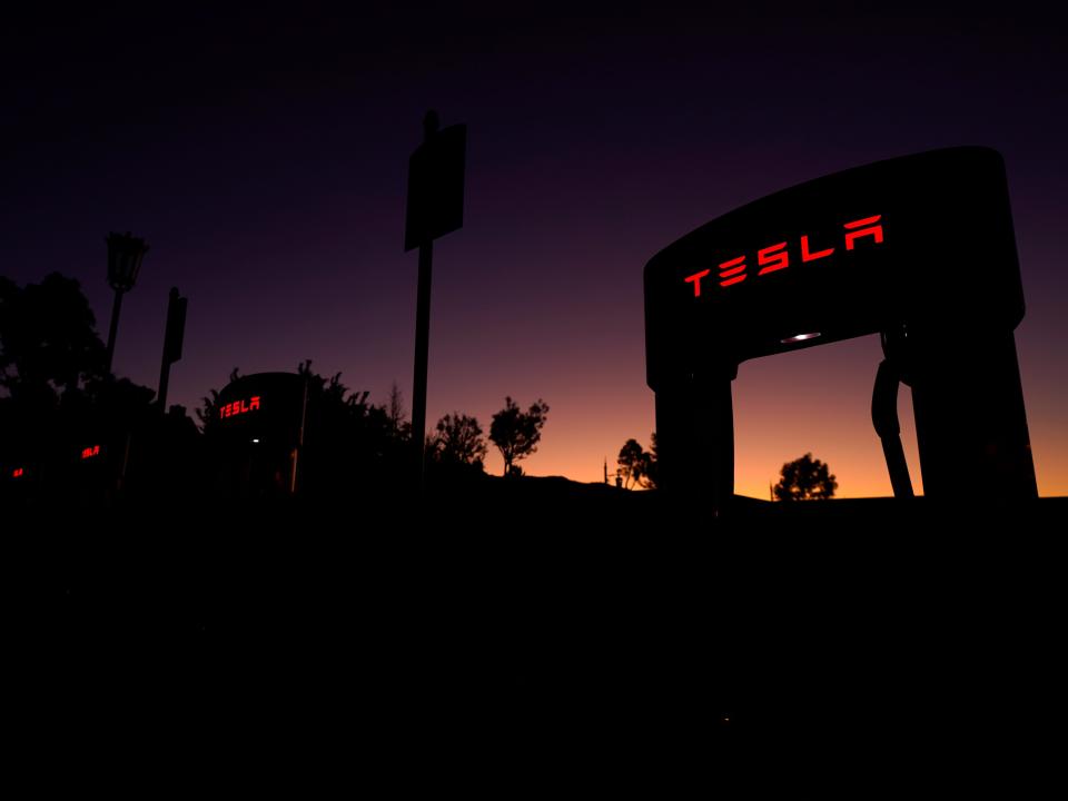 FILE PHOTO: Tesla superchargers are shown at a charging station in Santa Clarita, California, U.S. October 2, 2019.  REUTERS/Mike Blake