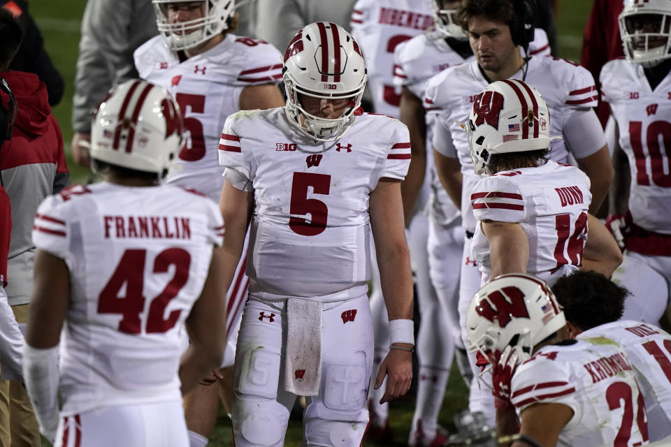 Wisconsin quarterback Graham Mertz (5) looks down at the bench during the second half of an NCAA college football game against Northwestern in Evanston, Ill., Saturday, Nov. 21, 2020. Northwestern won 17-7. (AP Photo/Nam Y. Huh)