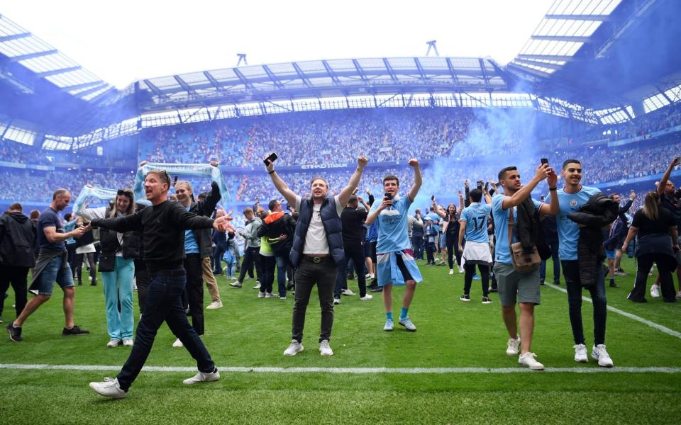 City fans invade the pitch after the match - Shaun Botterill/Getty Images