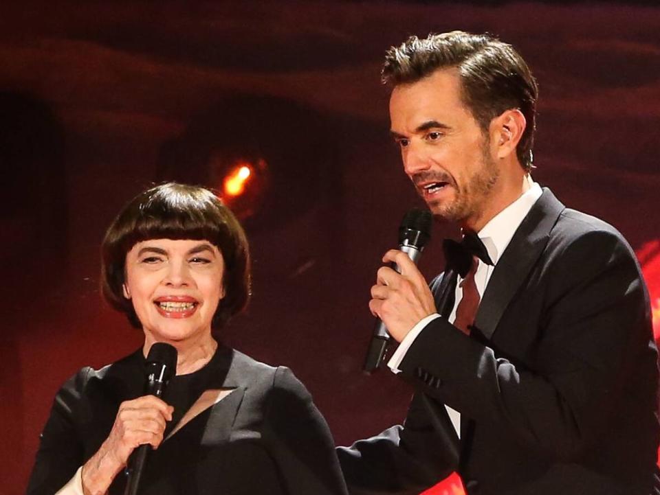 Mireille Mathieu und Florian Silbereisen 2018 bei einer Liveshow der ARD (Bild: imago images/Christian Schroedter)