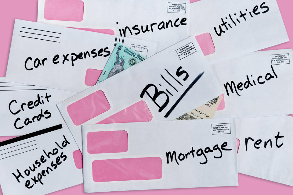 Several labeled envelopes scattered against a pink background