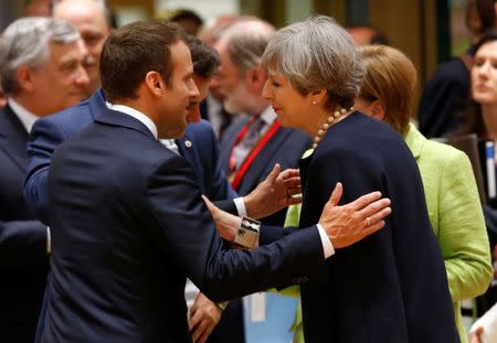 British Prime Minister Theresa May and French President Emmanuel Macron attend the EU summit in Brussels, Belgium, June 22, 2017. REUTERS/Francois Lenoir