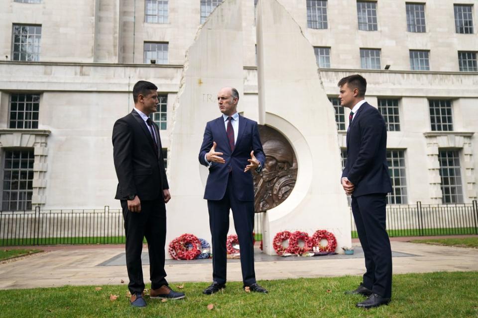 First Lieutenant Mohammad Jawad Akbari, veterans minister Leo Docherty and Captain Dave Kellett by the Iraq Afghanistan Memorial (Victoria Jones/PA) (PA Wire)