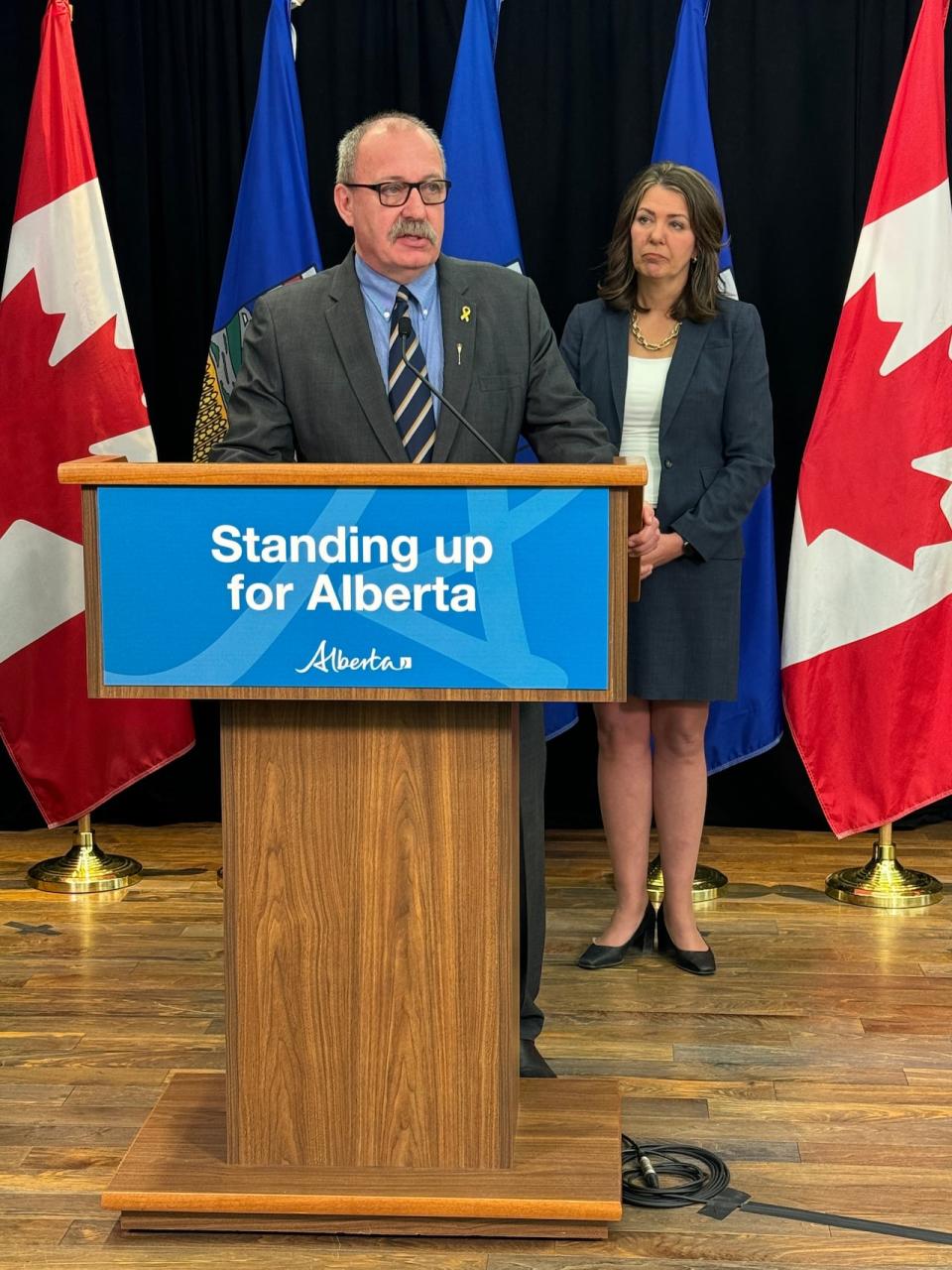 Municipal Affairs Minister Ric McIver and Alberta Premier Danielle Smith at a news conference Wednesday detailing the Provincial Priorities Act.