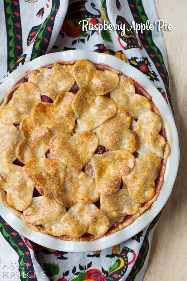 <p>Show your family some love with this heart-shaped raspberry apple pie. The fresh raspberries add a burst of color and flavor to the traditional fall dessert. </p><p><strong>Get the recipe at <a rel="nofollow noopener" href="https://www.aspicyperspective.com/apple-pie-recipe/" target="_blank" data-ylk="slk:A Spicy Perspective.;elm:context_link;itc:0;sec:content-canvas" class="link ">A Spicy Perspective. </a></strong><br></p>