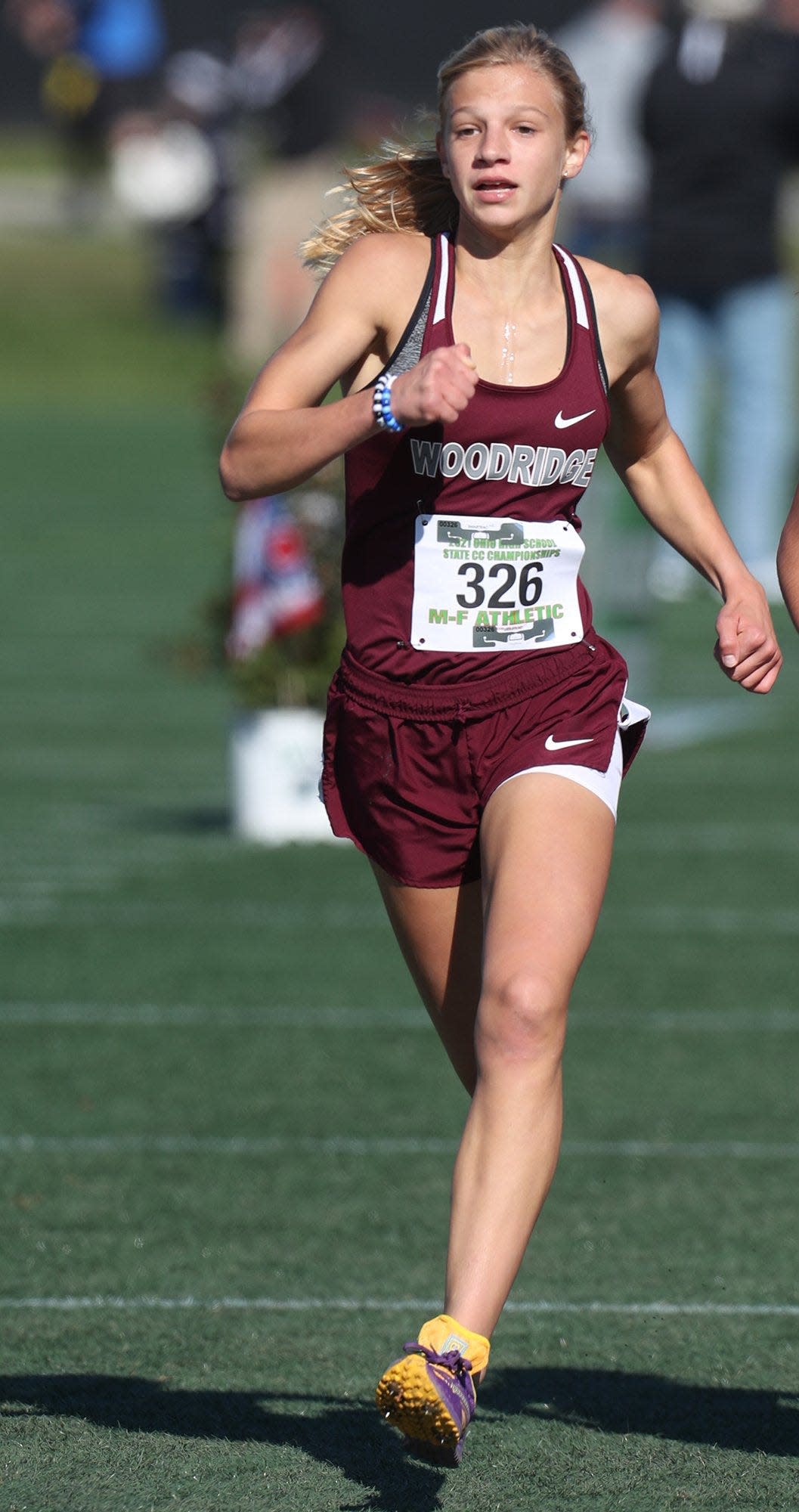 Woodridge Reese Reaman runs to a seventh place finish in the Division II girls cross country state championship meet at Fortress Obetz and Memorial Park in Obetz on Saturday, November 6, 2021. [Mike Cardew/Akron Beacon Journal]