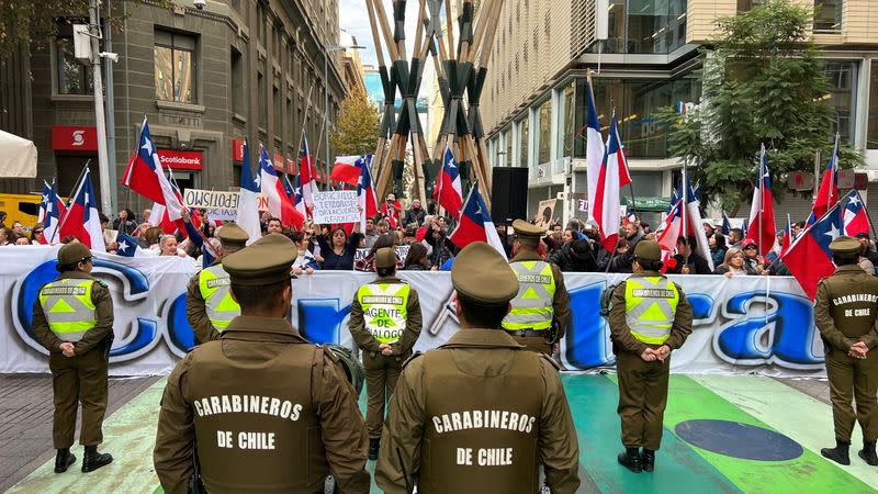 Demonstrators protest against the first session of Chile's Constitutional Council in Santiago