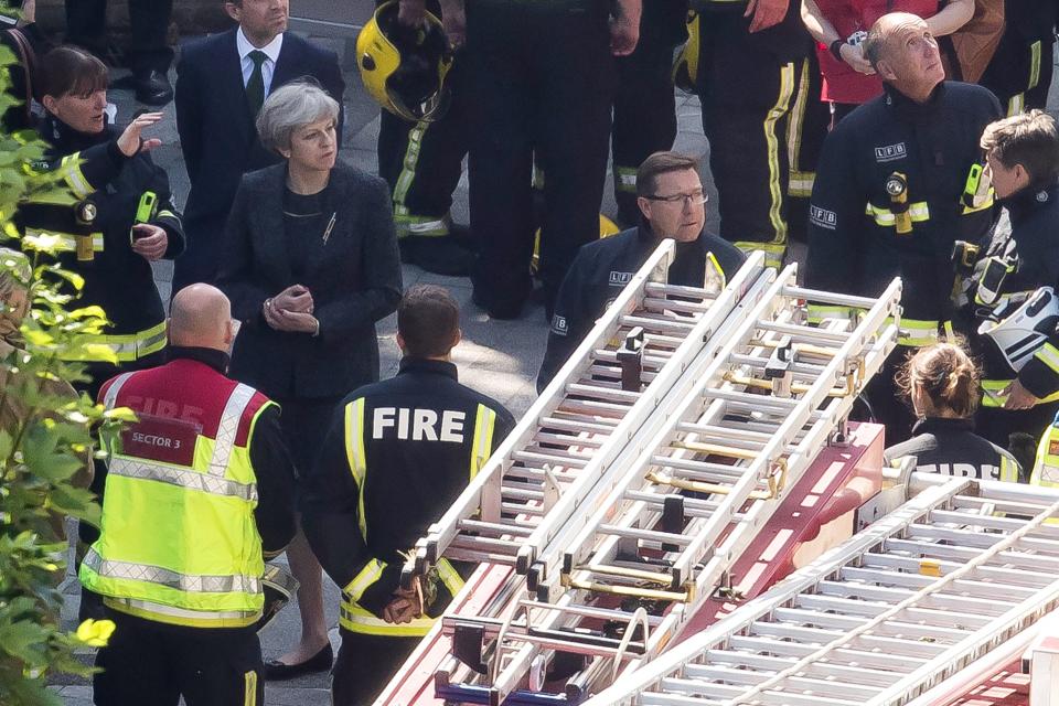 Theresa May visits Grenfell Tower