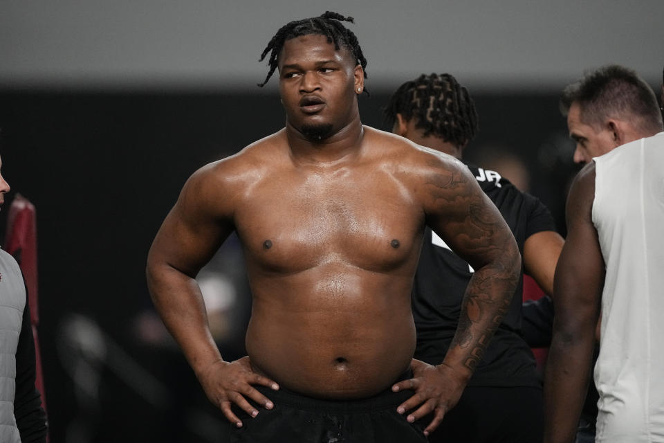 FILE - Former Georgia defensive lineman Jalen Carter stands after running football drills during Georgia's Pro Day, March 15, 2023, in Athens, Ga. The rarest commodity in the NFL is an elite defensive tackle who can be a dominant pass rusher. This class potentially has one of those in Carter, but he comes with some questions off the field. (AP Photo/John Bazemore, File)