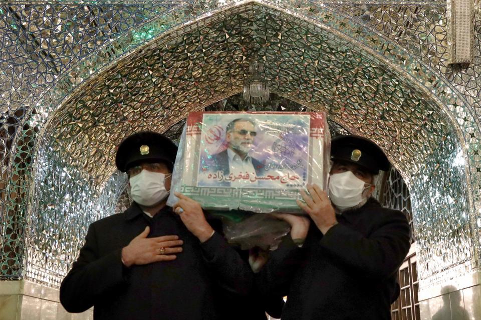 Servants of the Imam Reza Shrine carrying the coffin of Iran's assassinated top nuclear scientist Mohsen FakhrizadehIRANIAN DEFENCE MINISTRY/AFP via