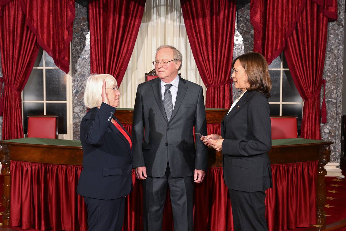 U.S. Sen. Patty Murray, D-Wash., left, reenacts being sworn in as Senate president pro tempore Tuesday, Jan. 3, in the old Senate Chamber. She is now third in the line of presidential succession.