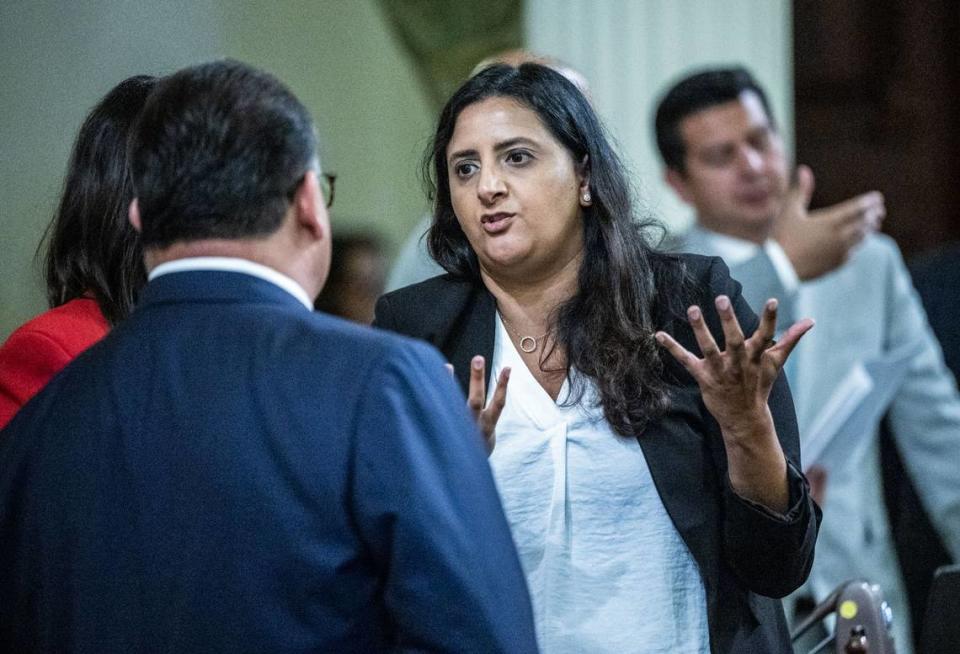 Assemblywoman Jasmeet Baines, D-Bakersfield, talks with colleagues during session on Thursday, June 1, 2023 to vote on bills.