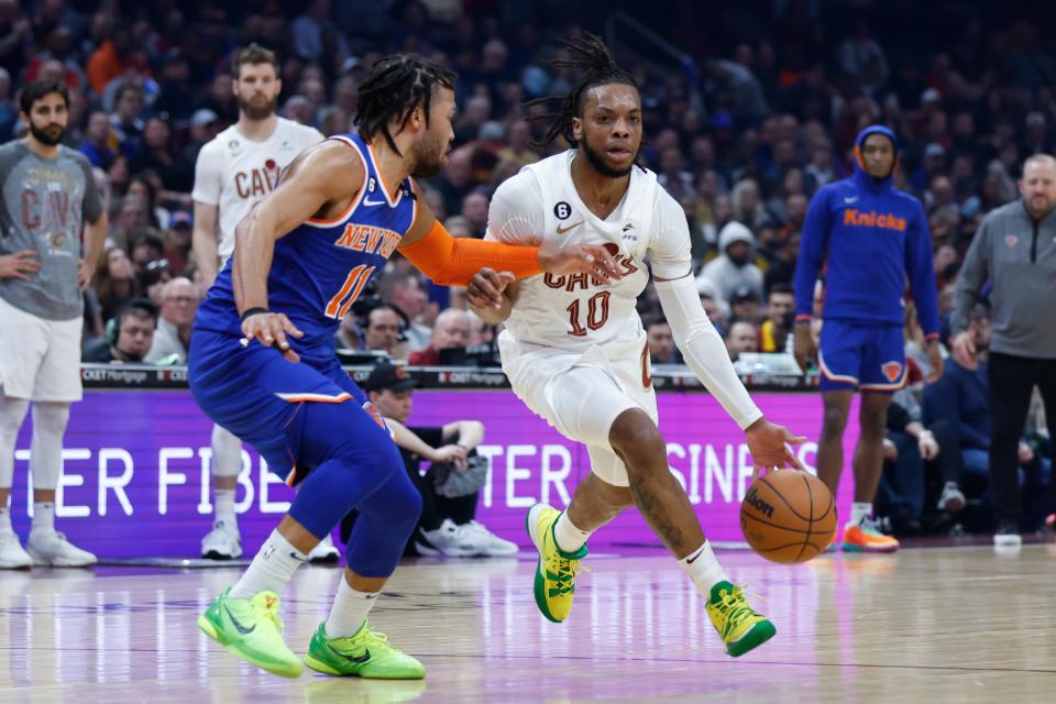 Cleveland Cavaliers guard Darius Garland (10) drives against New York Knicks guard Jalen Brunson (11) during the first half of an NBA basketball game Friday, March 31, 2023, in Cleveland. (AP Photo/Ron Schwane)