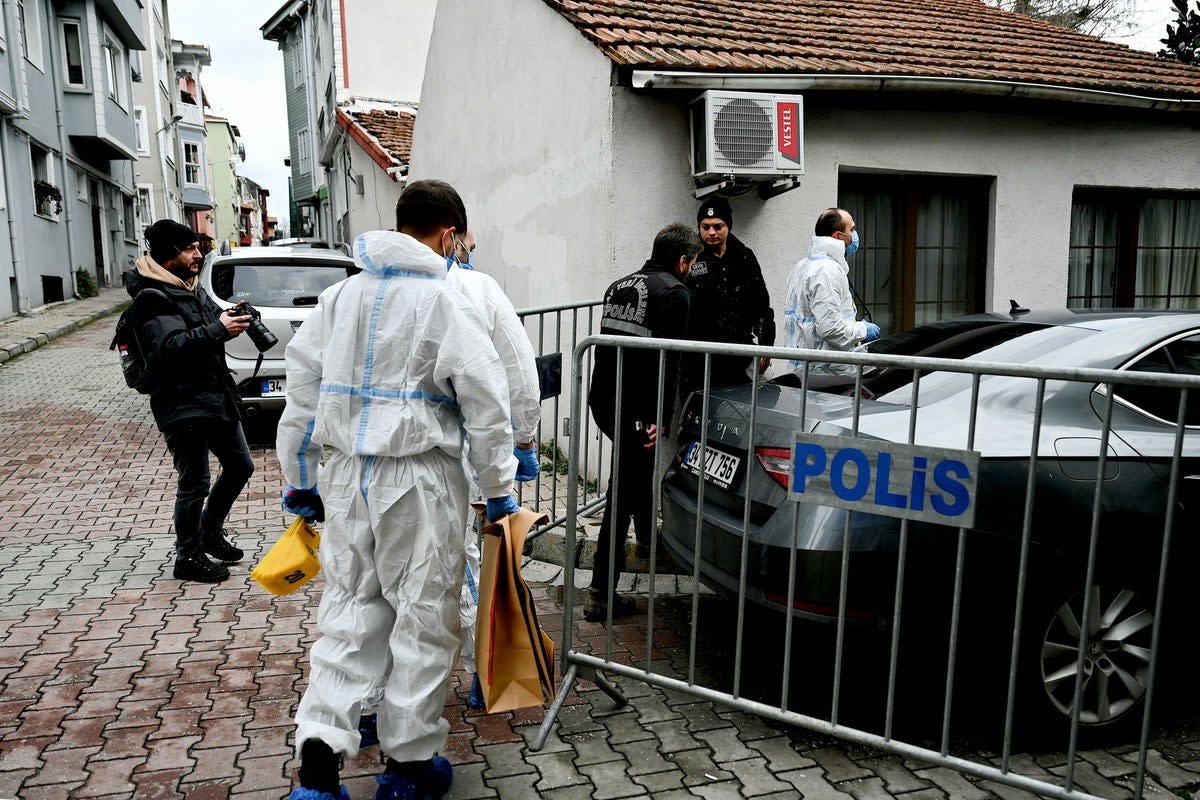 Turkish forensic police officers walk near Santa Maria church (Afp/AFP via Getty Images)