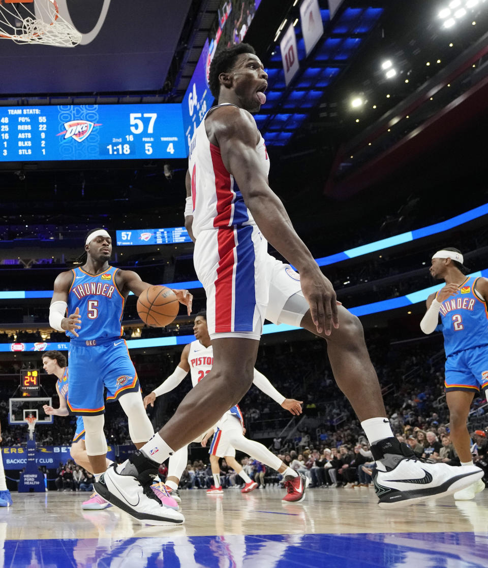 Detroit Pistons center Jalen Duren reacts after a dunk during the first half of an NBA basketball game against the Oklahoma City Thunder, Sunday, Jan. 28, 2024, in Detroit. (AP Photo/Carlos Osorio)