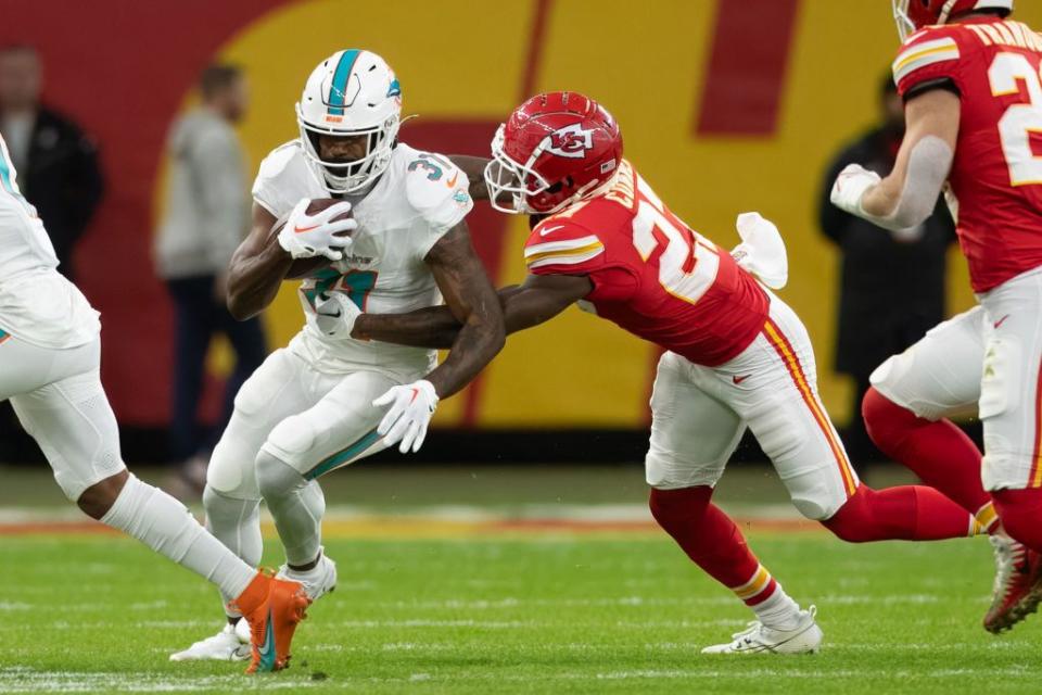 frankfurt am main, germany november 5 raheem mostert of miami dolphins and nikko remigio of kansas city chiefs battle for the ball during the nfl match between miami dolphins and kansas city chiefs at deutsche bank park on november 5, 2023 in frankfurt am main, germany photo by mario hommesdefodi images via getty images