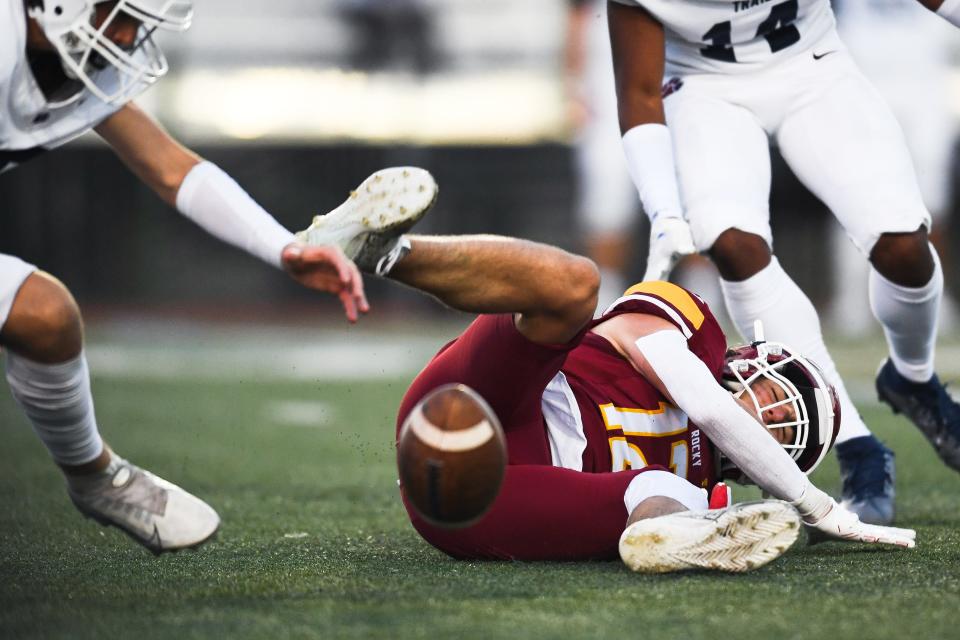 Rocky Mountain's Riley Honick (12) fumbles on a kick return during a high school football game against Cherokee Trail at home in Fort Collins on Thursday, Aug. 31, 2023. The Lobos lost 24-0.