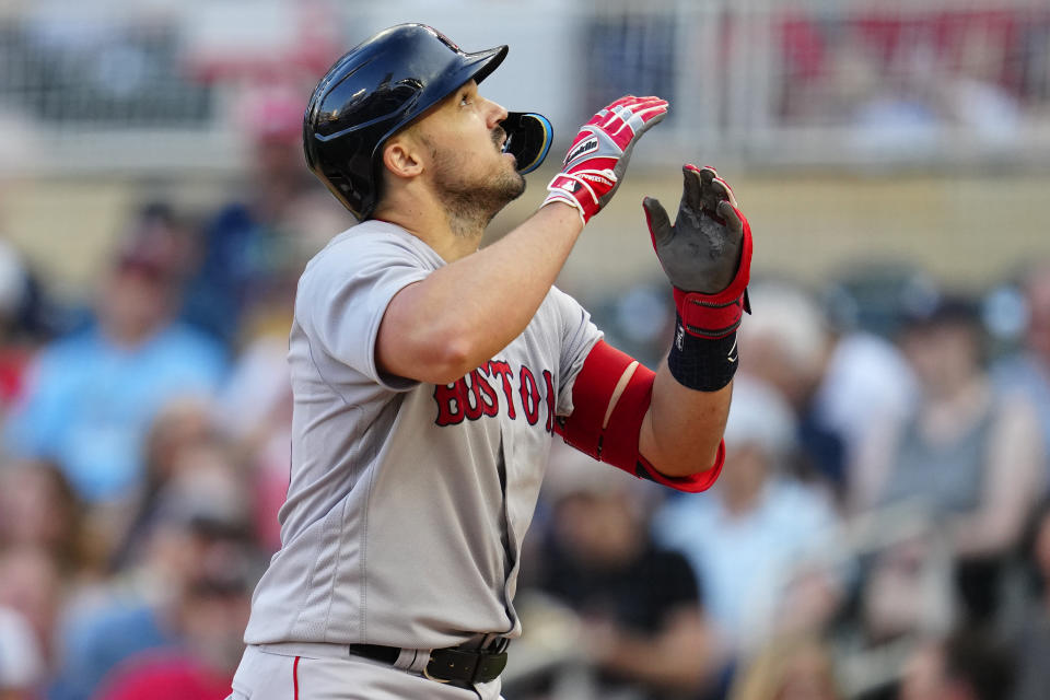 Boston Red Sox's Adam Duvall celebrates while crossing home plate after hitting a solo home run against the Minnesota Twins during the fourth inning of a baseball game Tuesday, June 20, 2023, in Minneapolis. (AP Photo/Abbie Parr)