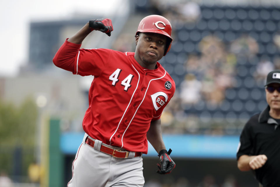 Cincinnati Reds' Aristides Aquino (44) rounds third base after hitting a solo home run off Pittsburgh Pirates starting pitcher Trevor Williams during the second inning of a baseball game in Pittsburgh, Sunday, Sept. 29, 2019. (AP Photo/Gene J. Puskar)