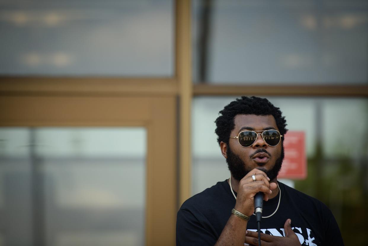 Christian Mosley, a local activist and podcast host, speaks at the Guns Down, Family Up event in front of the Cumberland County Courthouse on Saturday, June 24, 2023. Mosley said that he believes Fayetteville police discriminate against Black people in traffic stops and searches.