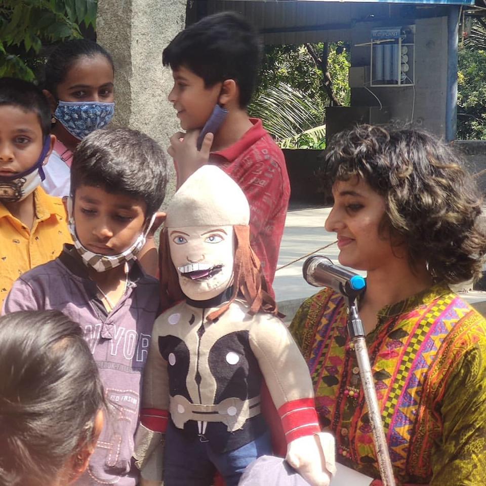 Sharanya entertaining the kids with her puppet at the Ragi Kana event