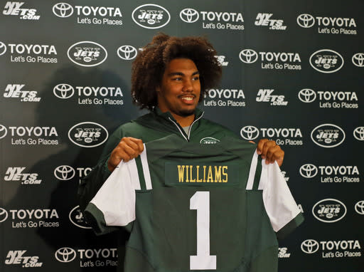 New York Jets draft pick Leonard Williams holds up a jersey as he is introduced to the media at the New York Jets facility Friday, May 1, 2015, in Florham Park, N.J. (AP Photo/Adam Hunger)