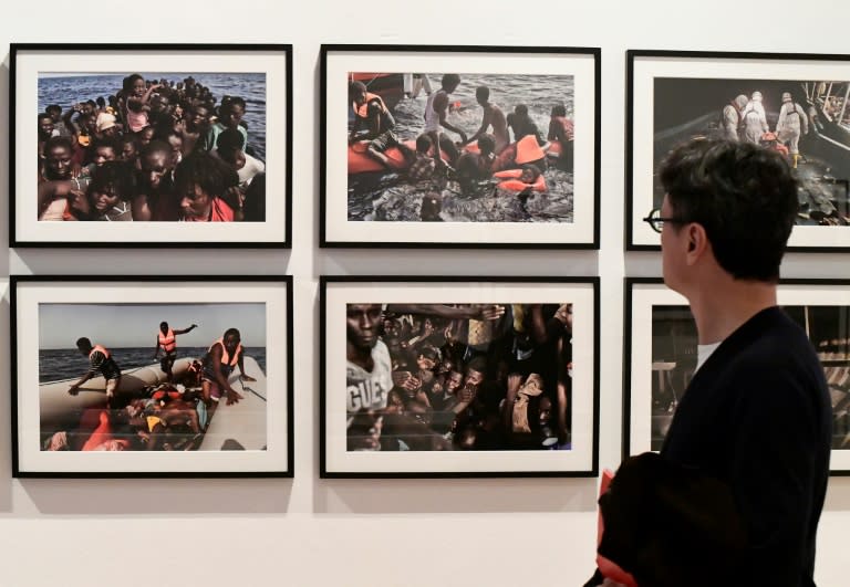 A Milan exhibit showing pictures from a migrant rescue operation taken by AFP photographer Aris Messinis off the Libyan coast