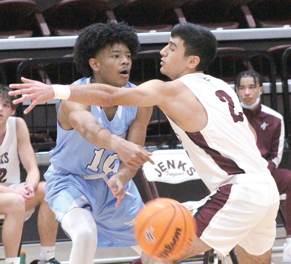 IT ALL STARTED WITH JENKS: Bartlesville High School freshman David Castillo makes a pass against Jenks High in his very first varsity game to open the 2020-21 season. He scored 20 points.